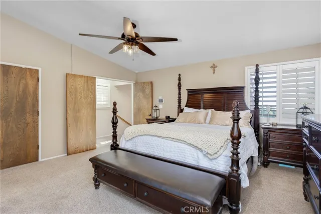 a bathroom with a granite countertop double vanity sink and a mirror