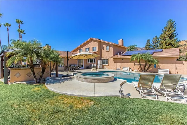 a view of a house with a yard and plants