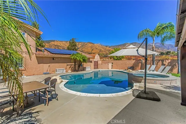 a view of a dirt road with a building in the background