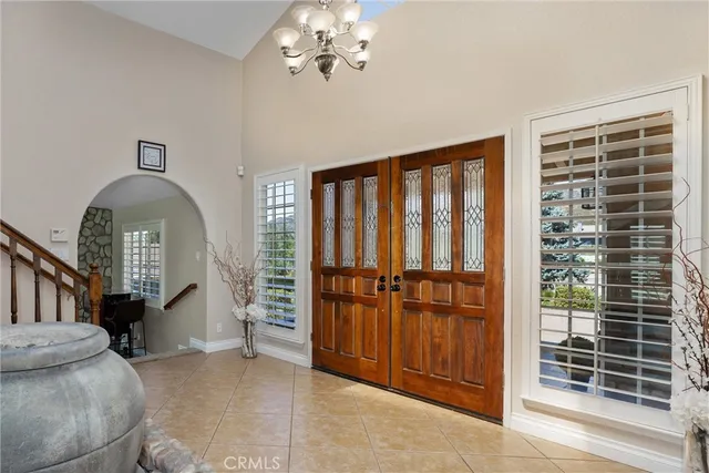 a living room with furniture and stairs