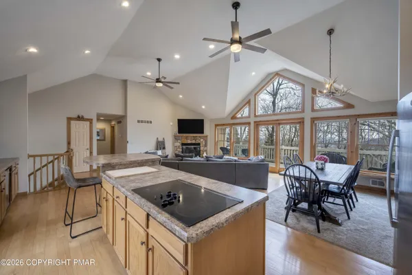 a kitchen with a stove a table and chairs