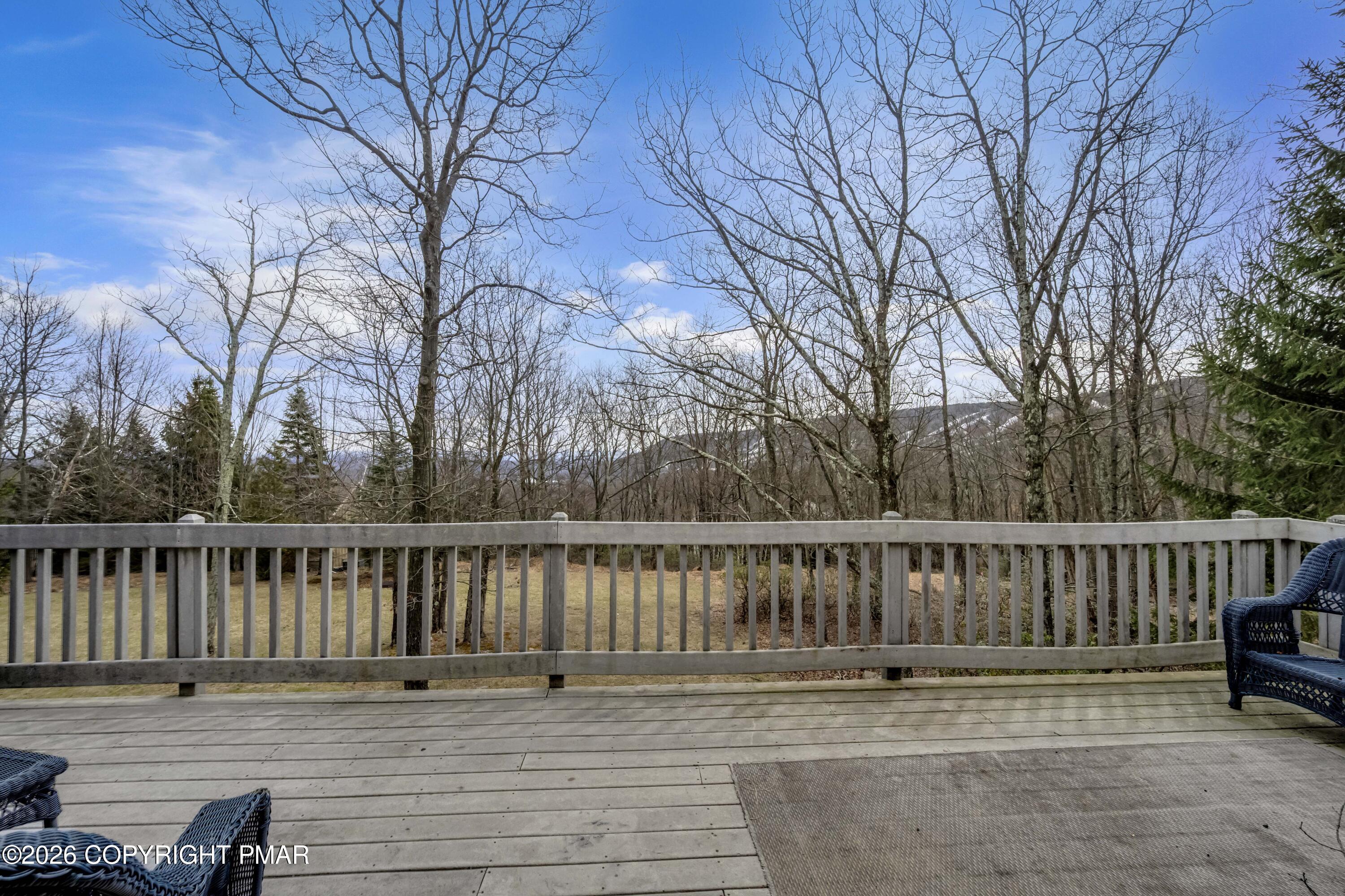 188 Upper Deer Valley Road Tannersville, PA 18372 - Photo 13 of 49 a view of wooden deck with a chair and wooden floor
