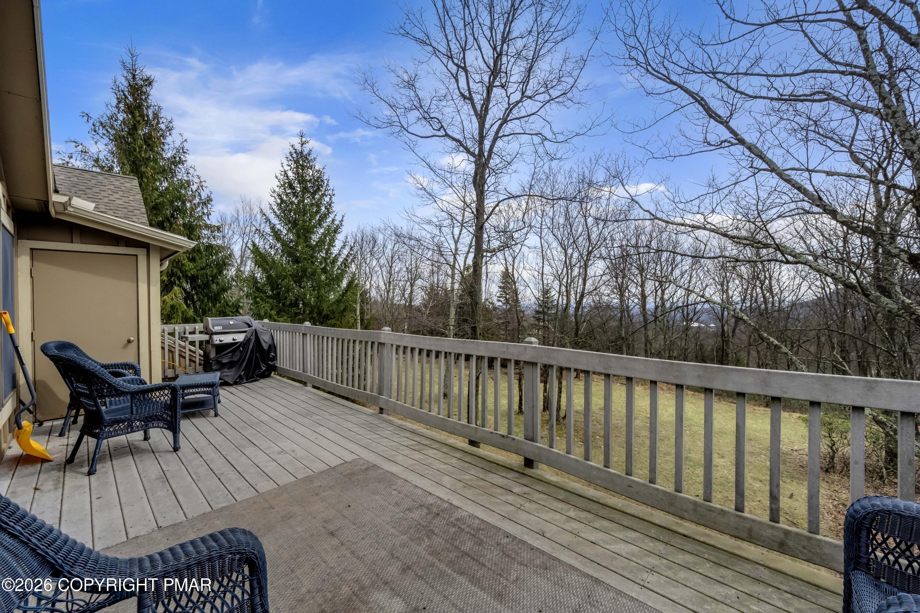 188 Upper Deer Valley Road Tannersville, PA 18372 - Photo 15 of 49 a view of a roof deck with table and chairs and wooden floor