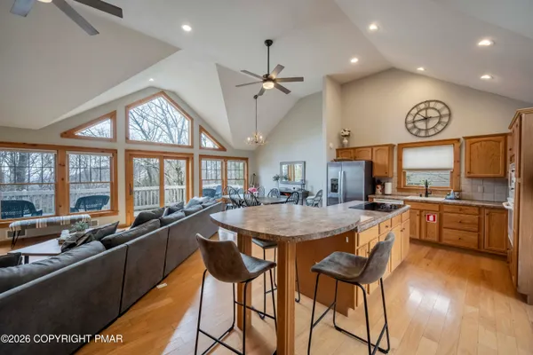 a large kitchen with a table and chairs