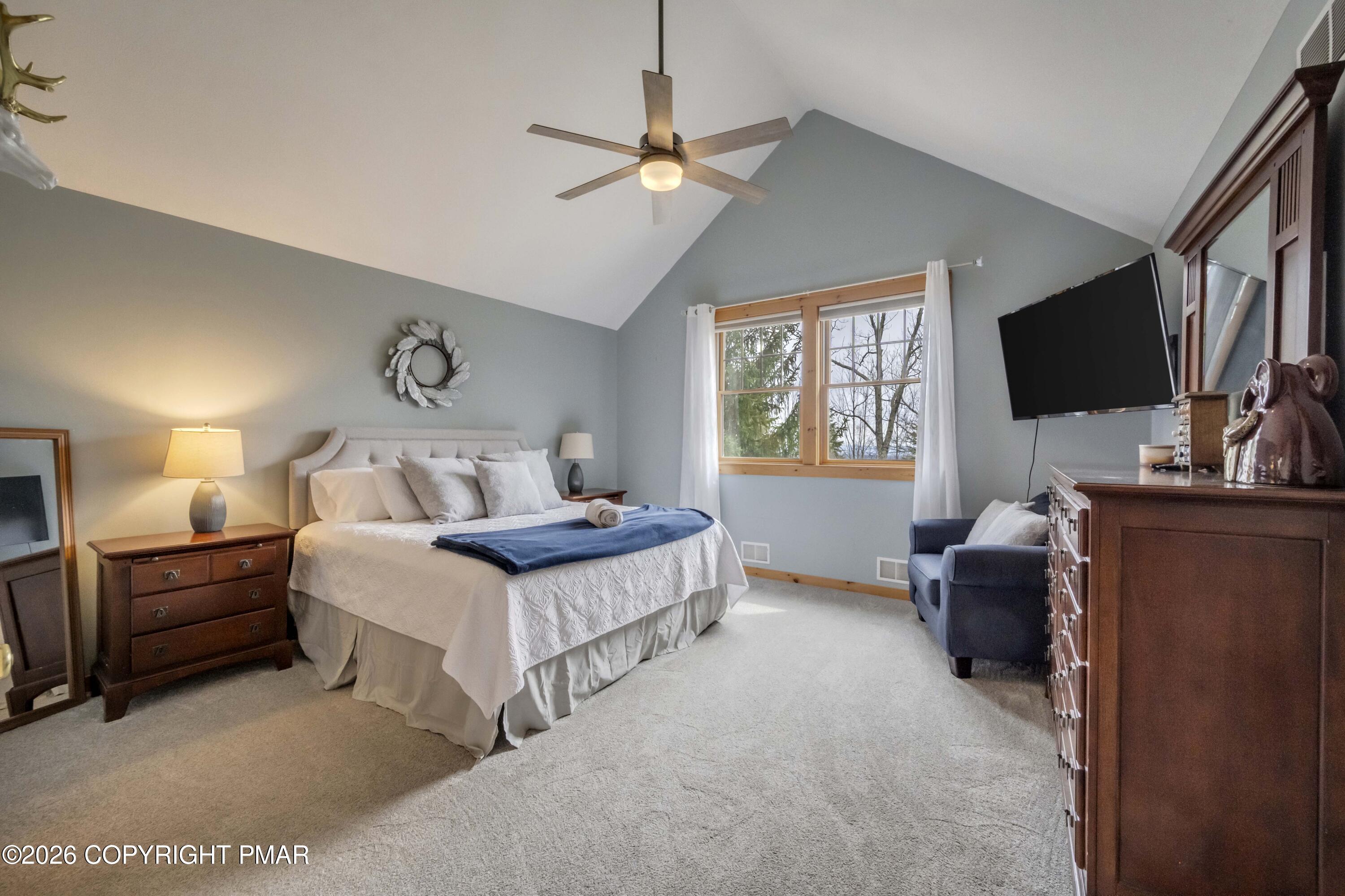 188 Upper Deer Valley Road Tannersville, PA 18372 - Photo 19 of 49 a bedroom with a bed and a flat screen tv