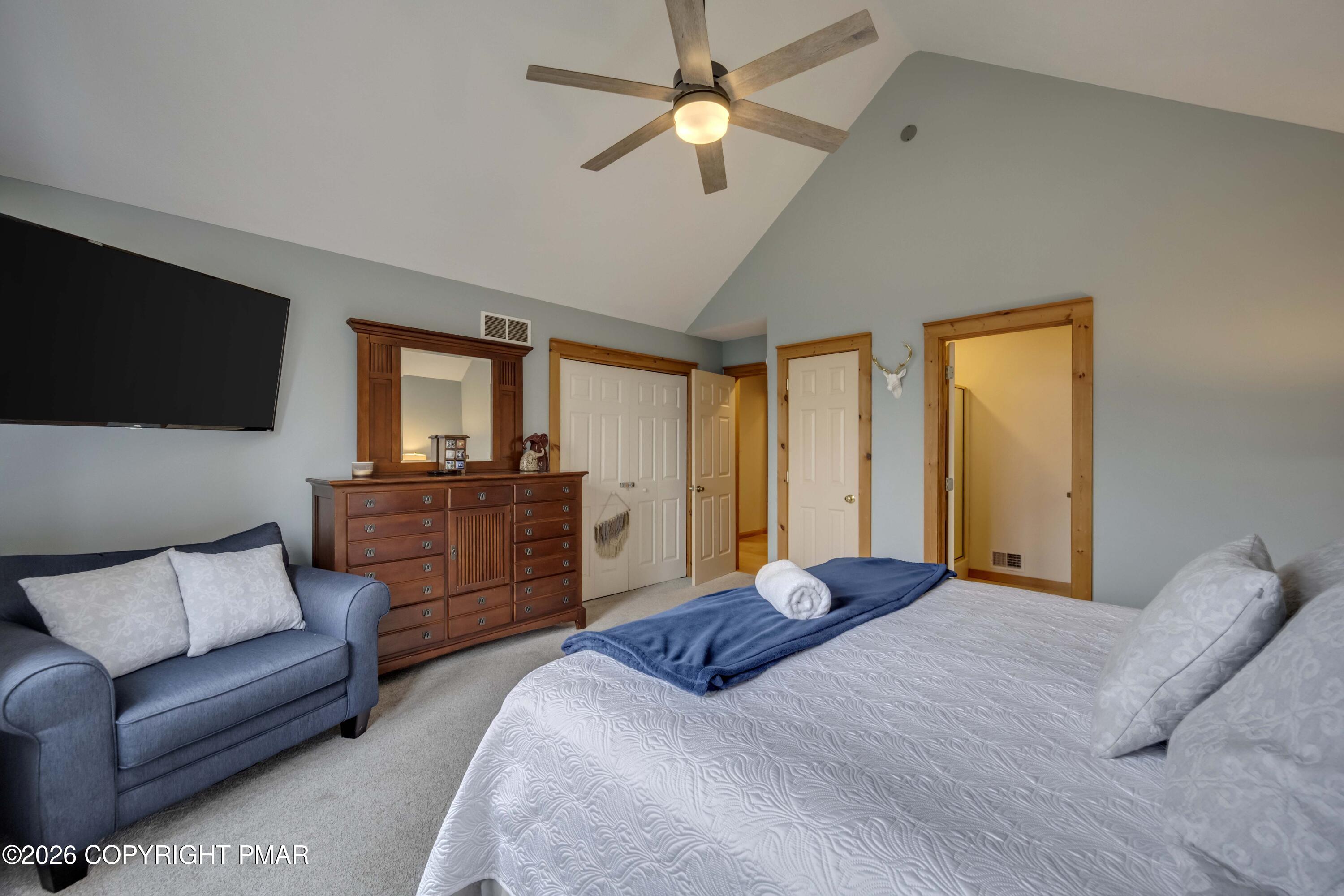 188 Upper Deer Valley Road Tannersville, PA 18372 - Photo 20 of 49 a bedroom with a large bed and a couch