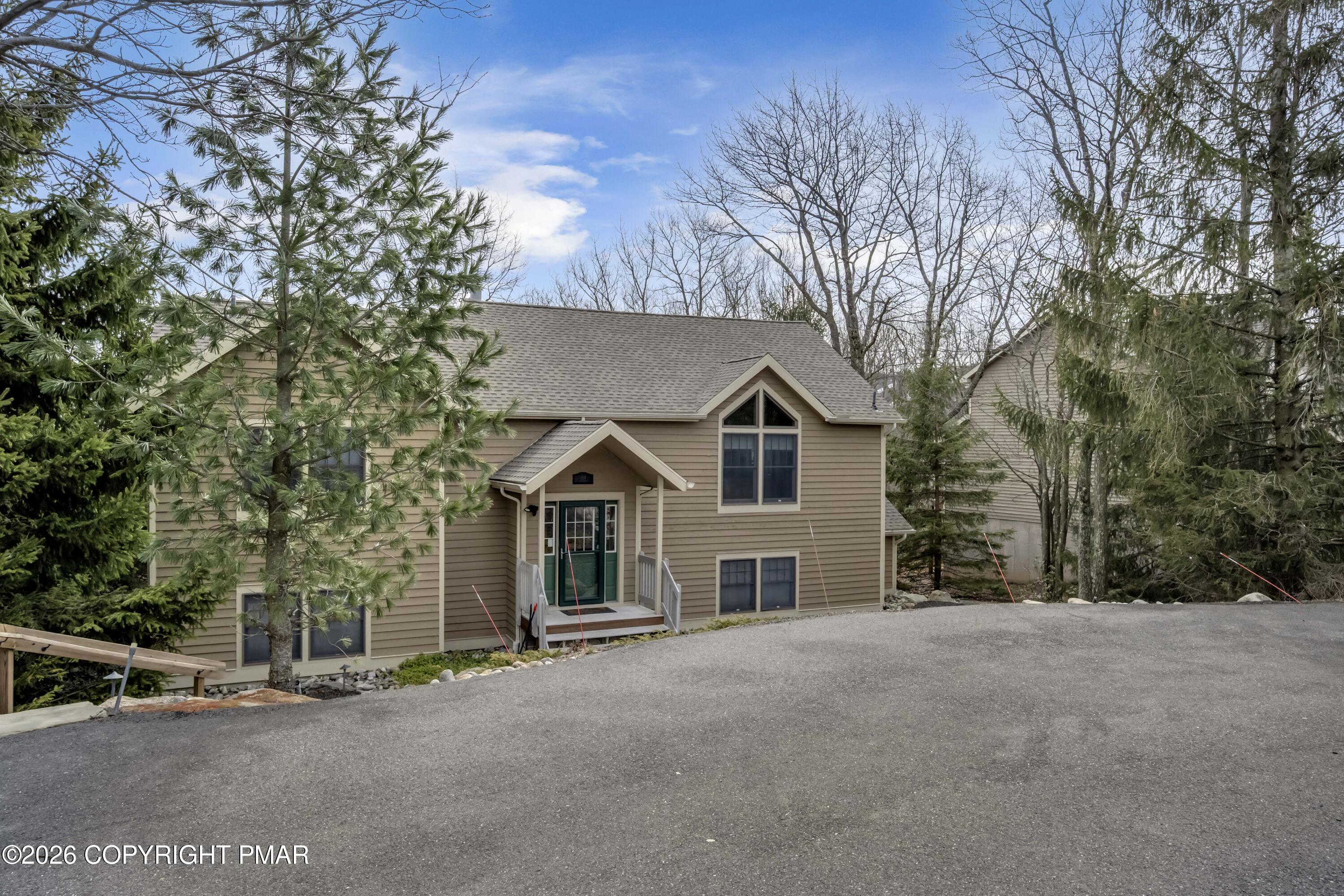188 Upper Deer Valley Road Tannersville, PA 18372 - Photo 2 of 49 front view of a house with a street