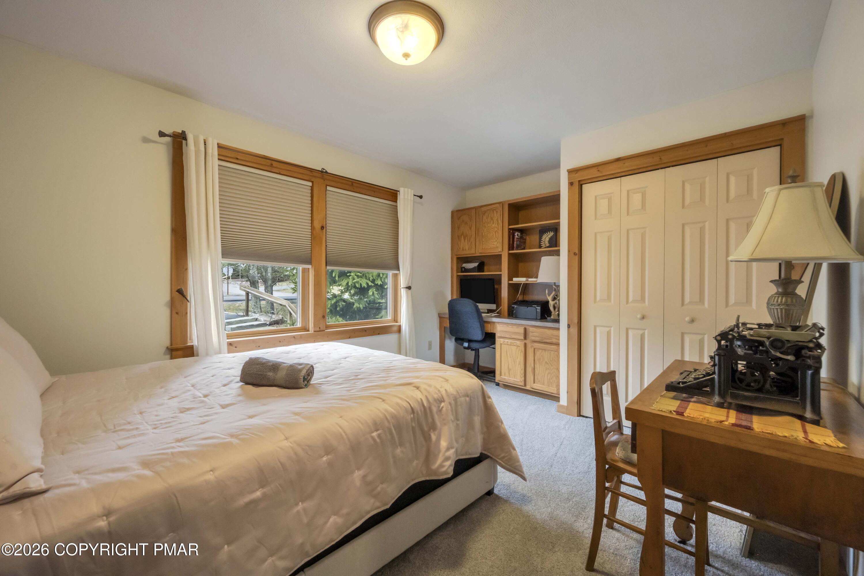 188 Upper Deer Valley Road Tannersville, PA 18372 - Photo 22 of 49 a bedroom with a bed and a window