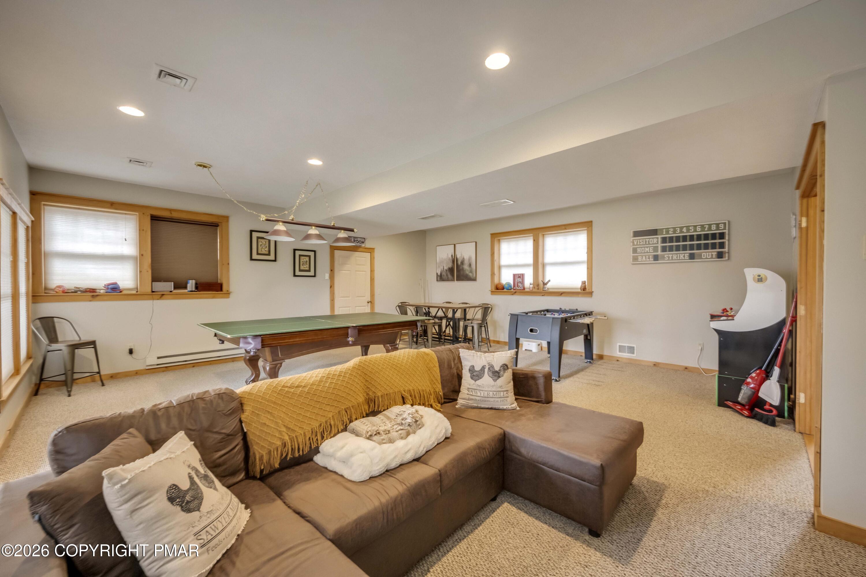 188 Upper Deer Valley Road Tannersville, PA 18372 - Photo 26 of 49 a living room with furniture and a wooden floor