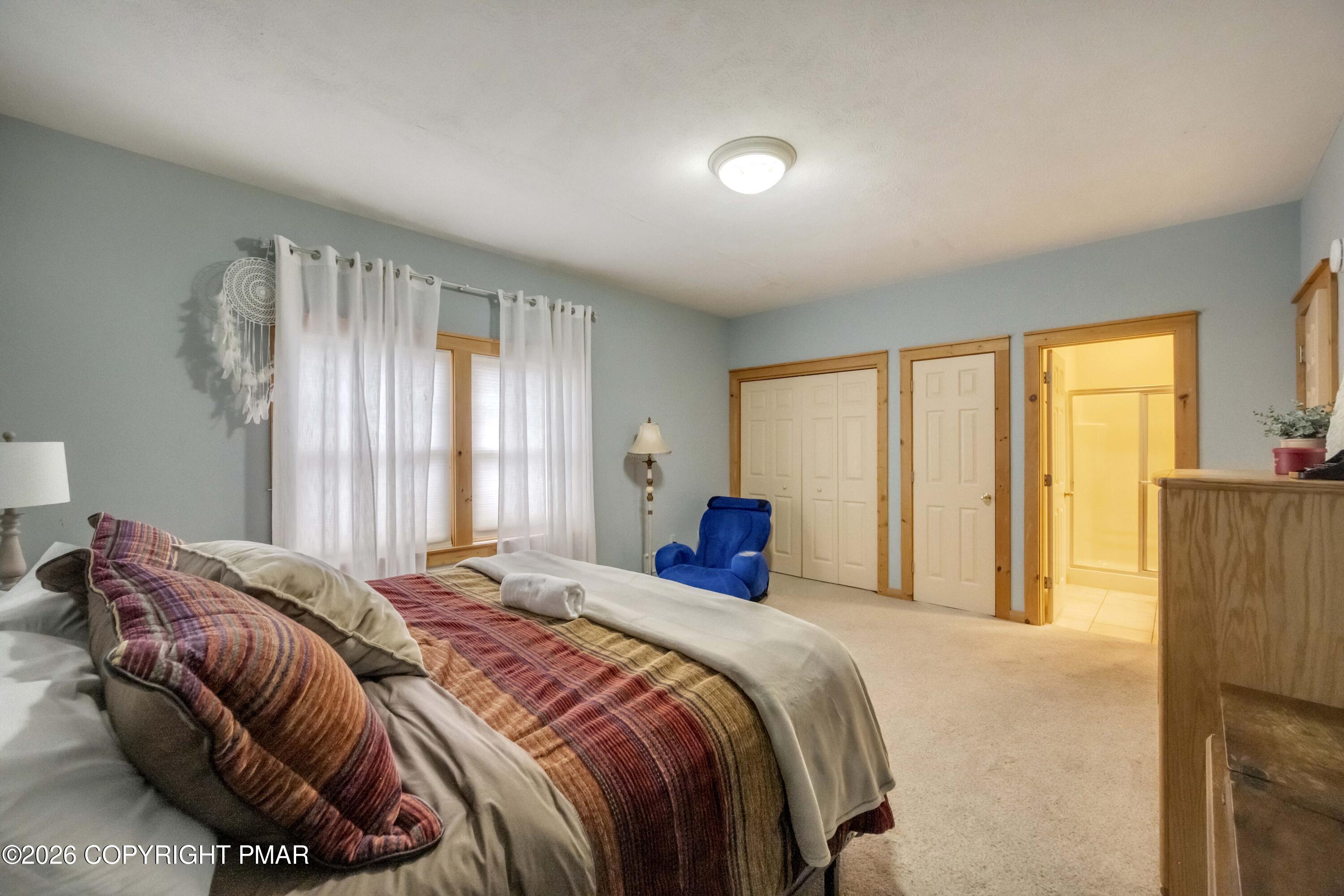 188 Upper Deer Valley Road Tannersville, PA 18372 - Photo 32 of 49 a bedroom with a bed and a window