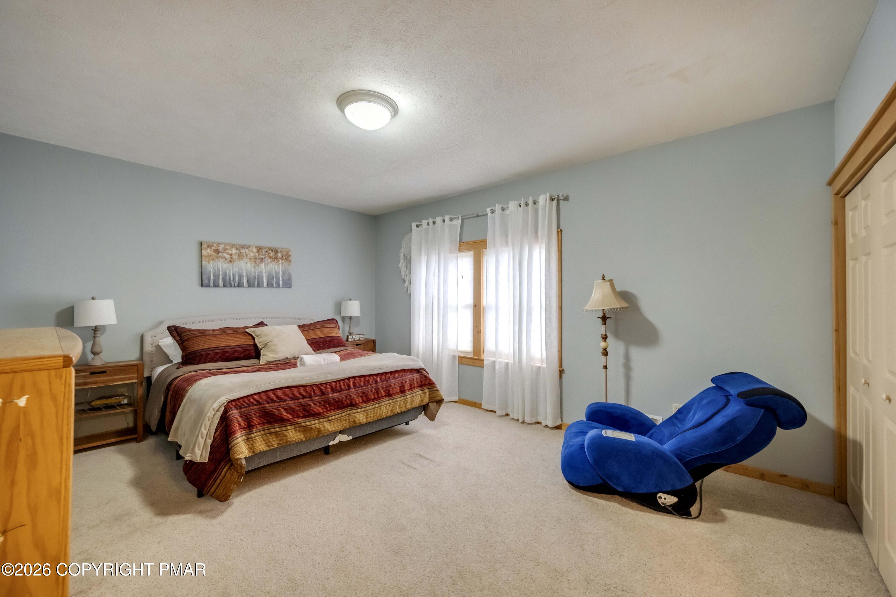 188 Upper Deer Valley Road Tannersville, PA 18372 - Photo 33 of 49 a bedroom with a bed and a couch