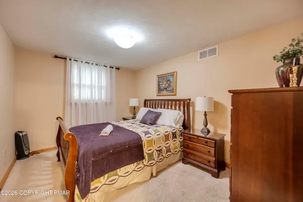 a bedroom with a bed and a cabinets