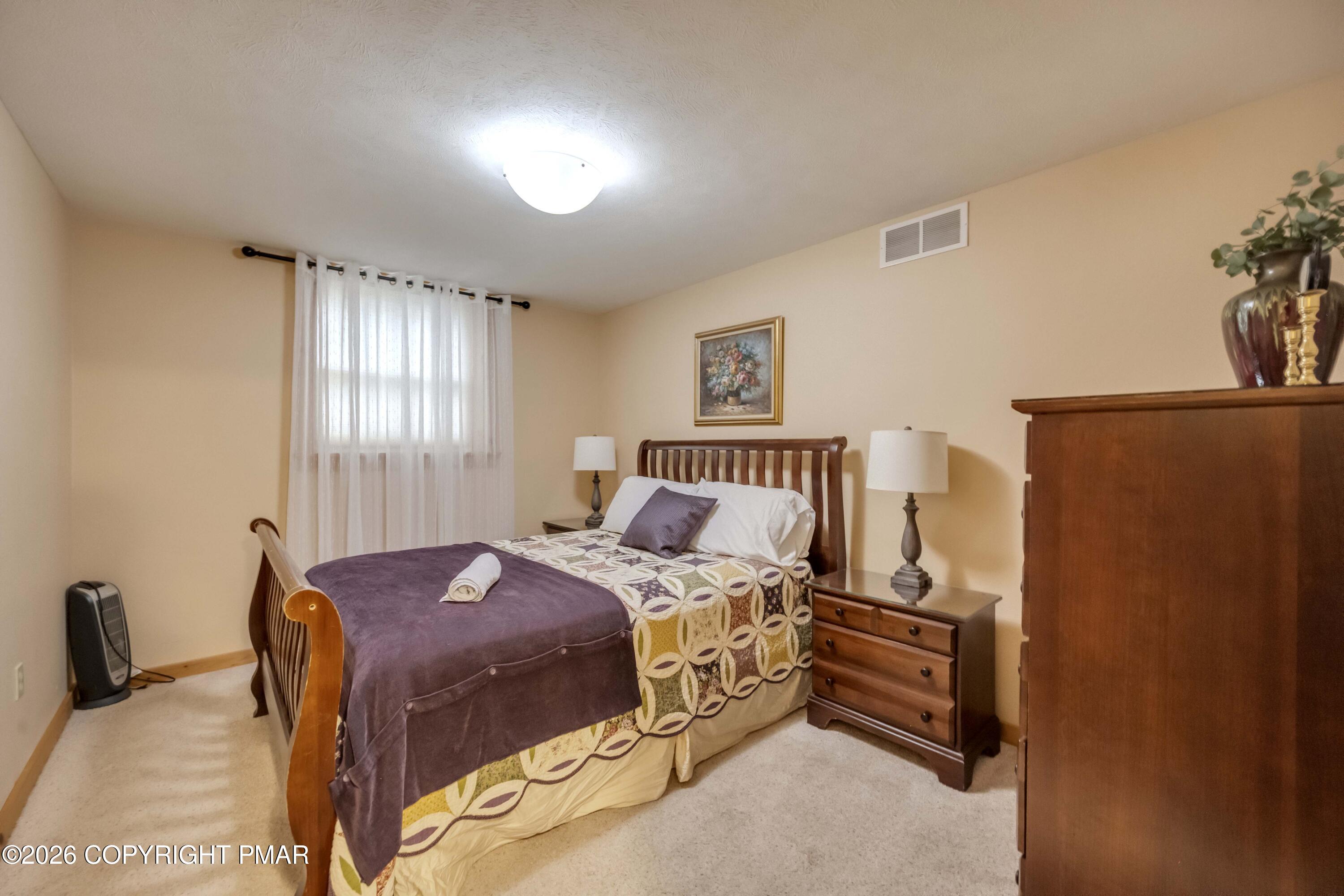 188 Upper Deer Valley Road Tannersville, PA 18372 - Photo 35 of 49 a bedroom with a bed and a cabinets