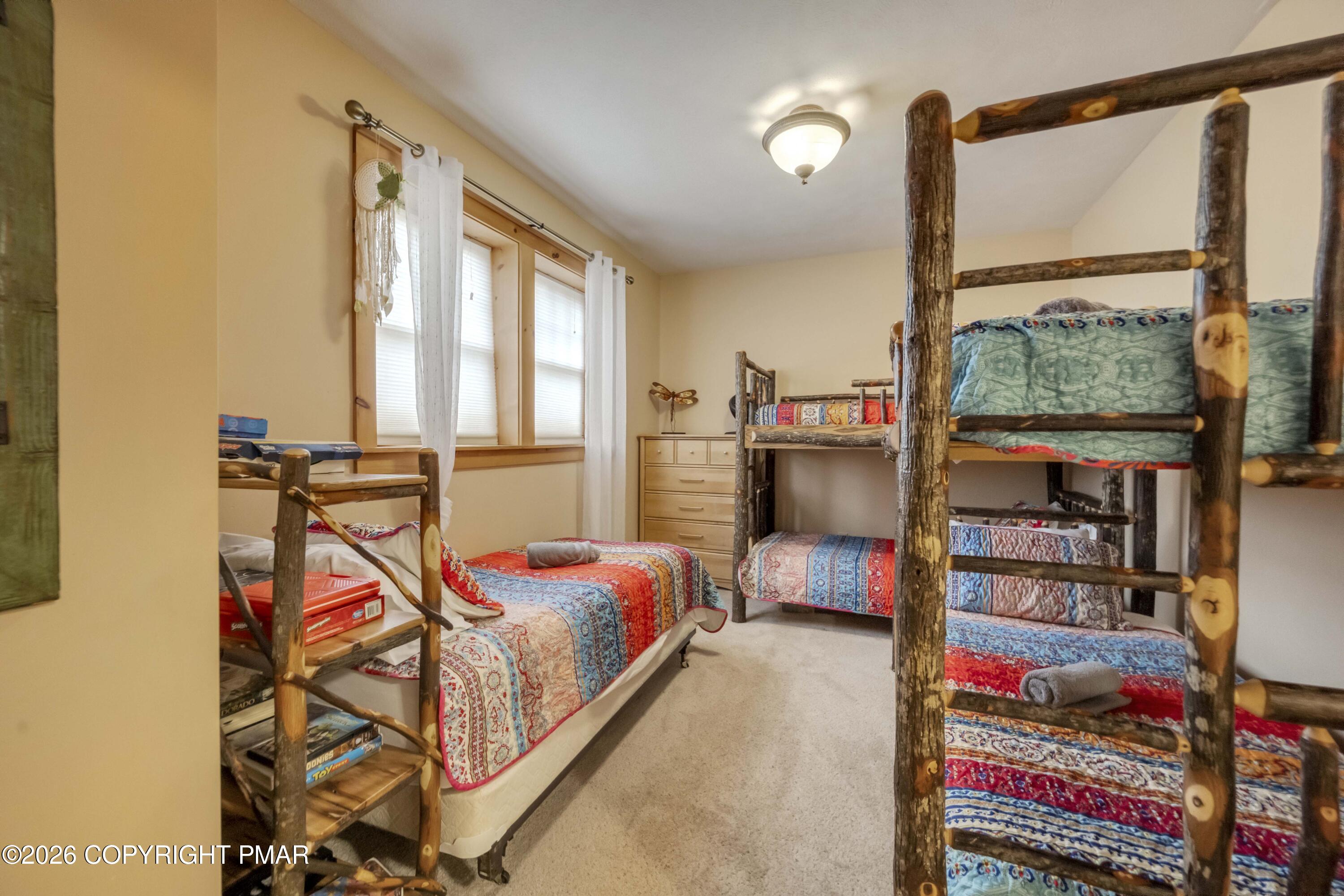 188 Upper Deer Valley Road Tannersville, PA 18372 - Photo 38 of 49 a bedroom with bed and a window