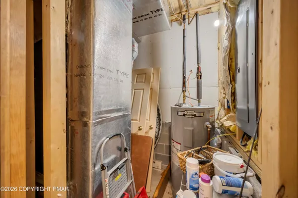 a bathroom with a sink and mirror with bathtub