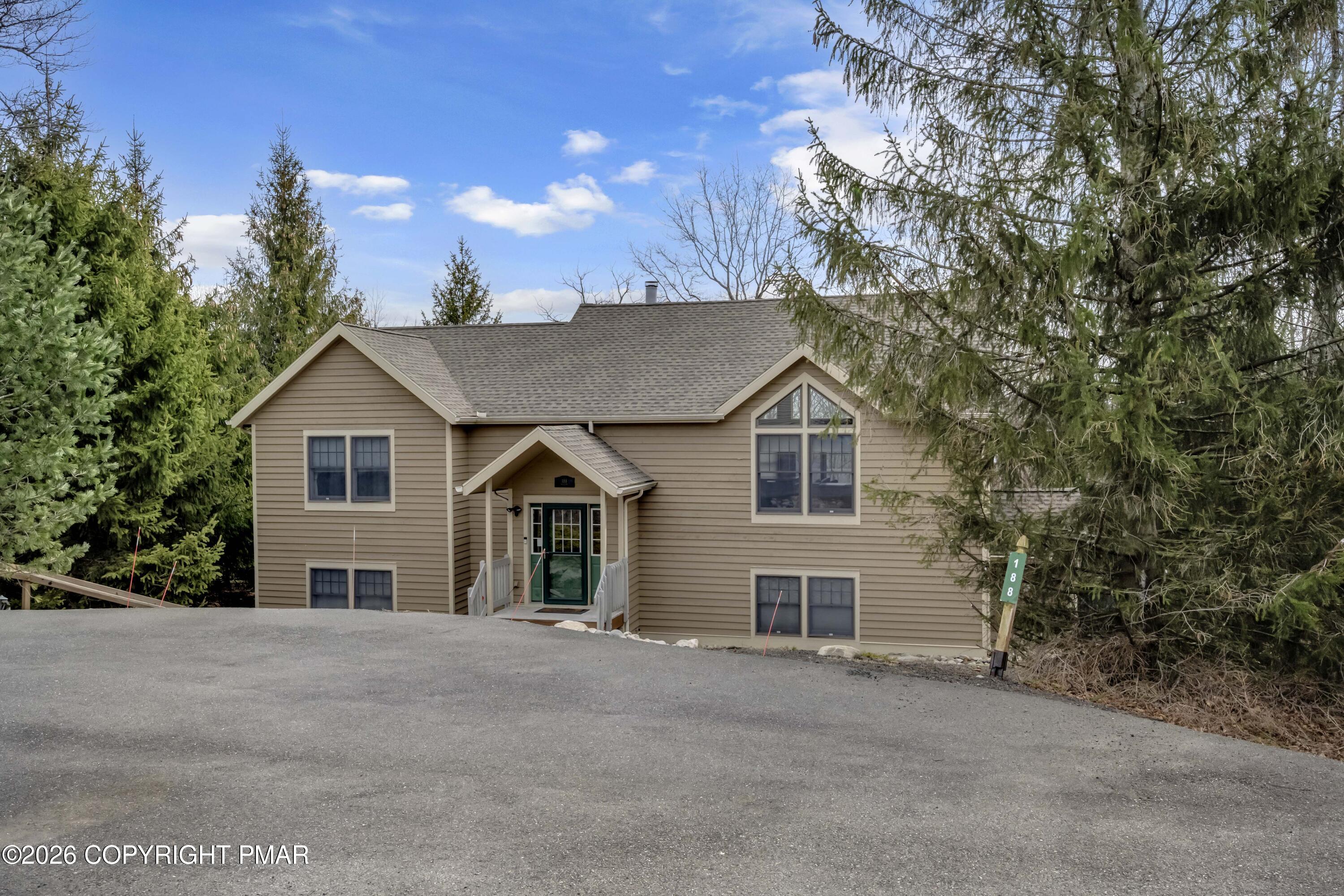 188 Upper Deer Valley Road Tannersville, PA 18372 - Photo 43 of 49 a view of a house with a yard and large tree