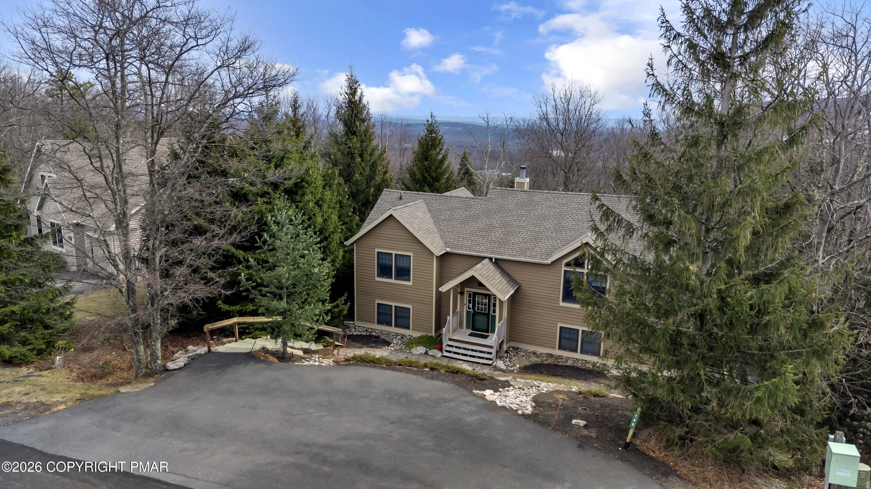 188 Upper Deer Valley Road Tannersville, PA 18372 - Photo 49 of 49 a view of a house with a yard and sitting area