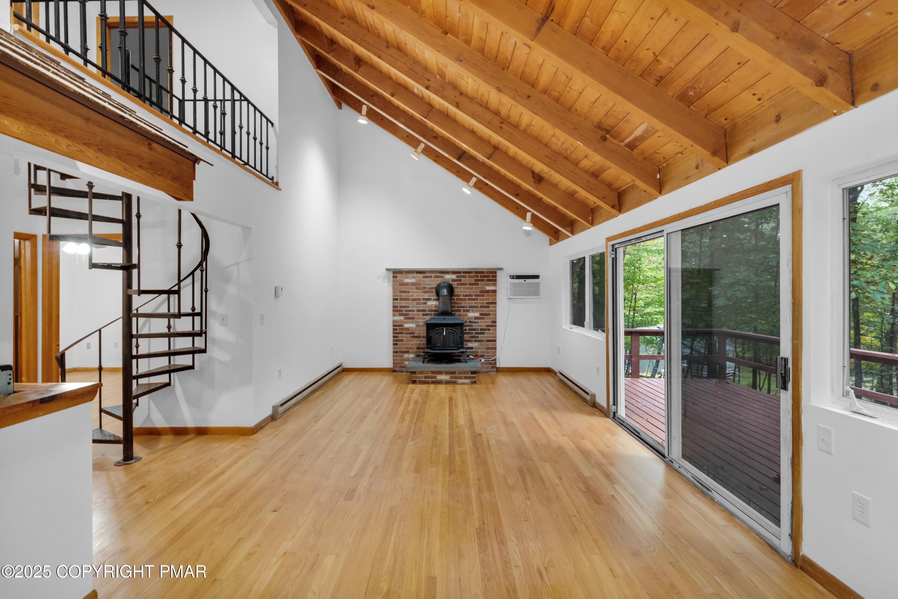 326 Otter Court Bushkill, PA 18324 - Photo 11 of 47 a view of empty room with wooden floor and fireplace
