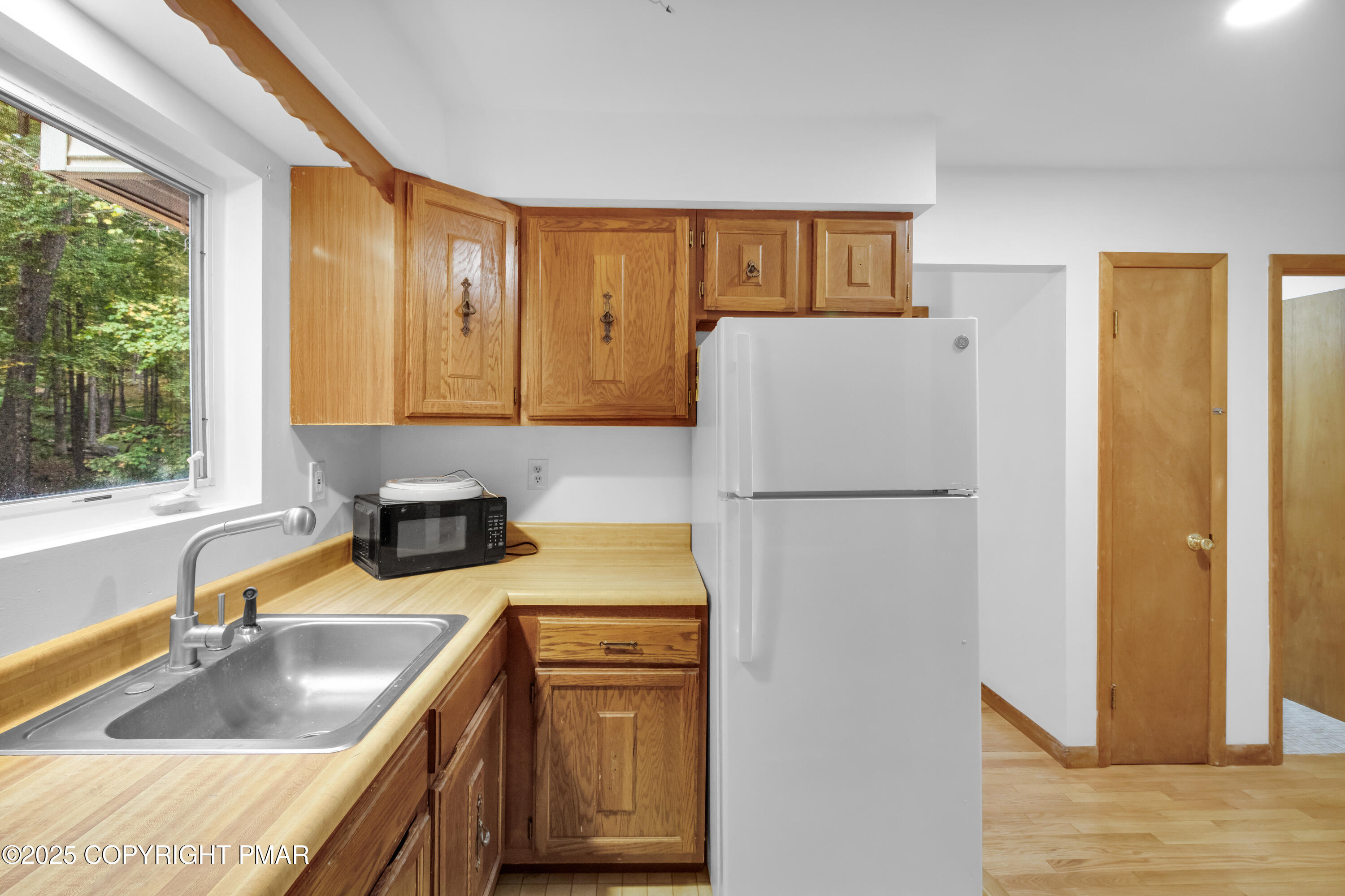 326 Otter Court Bushkill, PA 18324 - Photo 14 of 47 a kitchen with stainless steel appliances granite countertop a refrigerator sink and stove