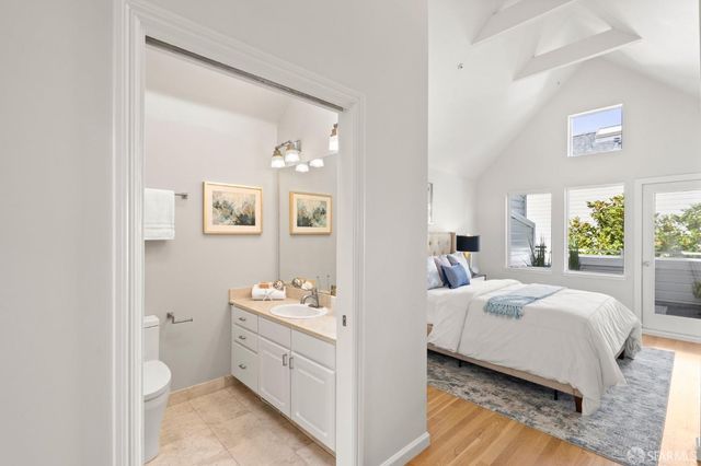 a room with a bed and a view of bathroom