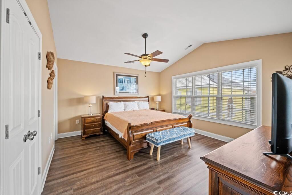520 Caribbean Way Myrtle Beach, SC 29577 - Photo 12 of 21 Bedroom with lofted ceiling, a ceiling fan, dark wood finished floors, and a closet