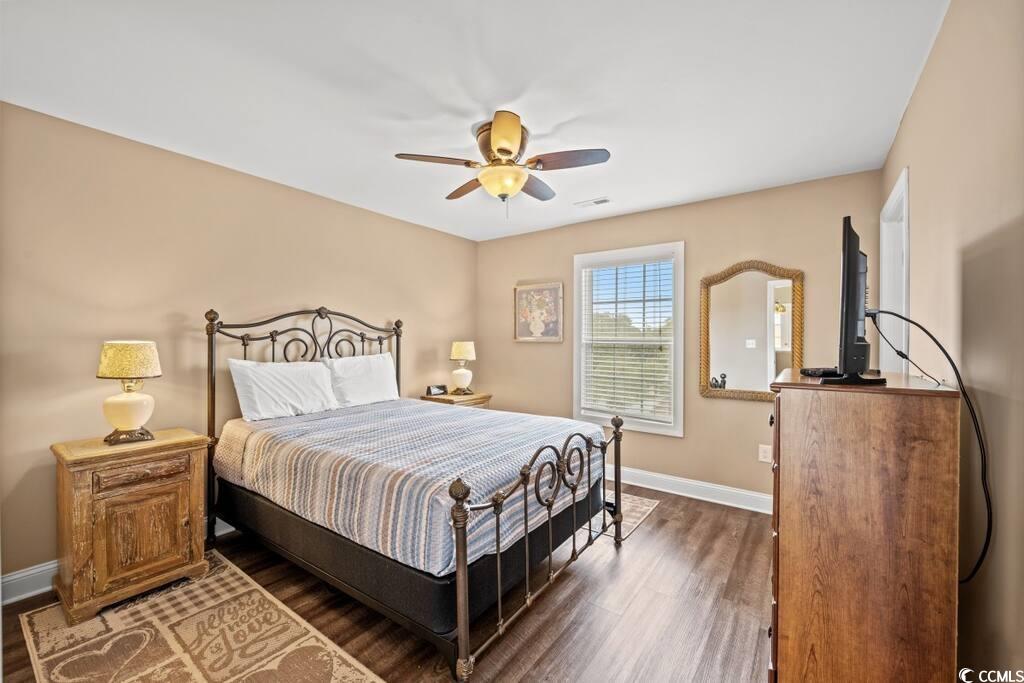 520 Caribbean Way Myrtle Beach, SC 29577 - Photo 14 of 21 Bedroom featuring wood finished floors and ceiling fan
