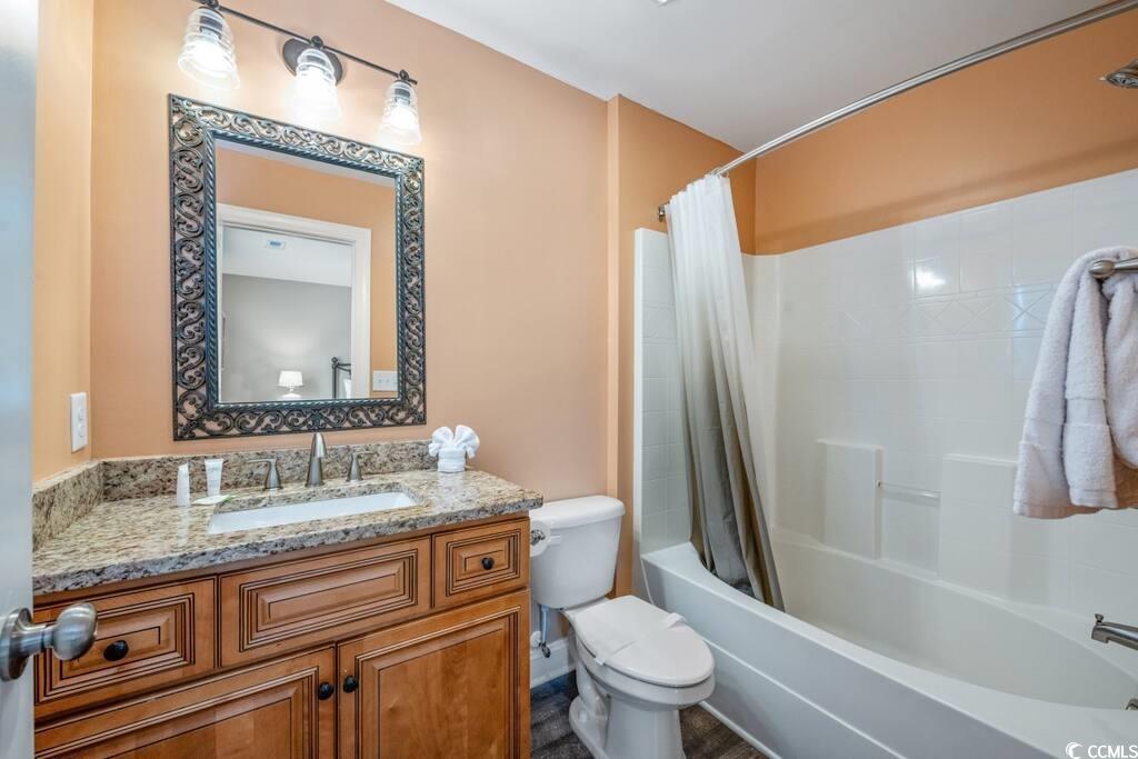 520 Caribbean Way Myrtle Beach, SC 29577 - Photo 15 of 21 Full bath featuring vanity and shower / tub combo with curtain