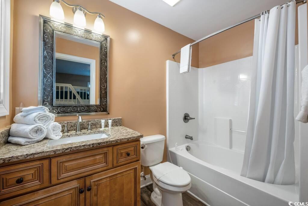 520 Caribbean Way Myrtle Beach, SC 29577 - Photo 17 of 21 Full bath with shower / bath combination with curtain and vanity