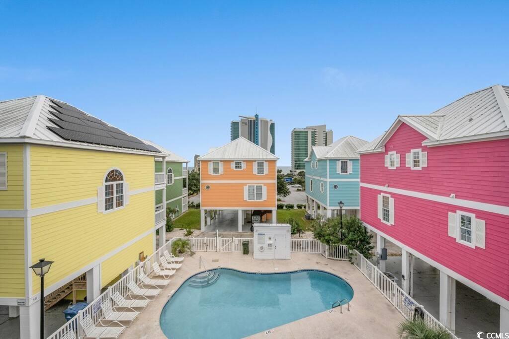 520 Caribbean Way Myrtle Beach, SC 29577 - Photo 20 of 21 Community pool with a patio and stairs