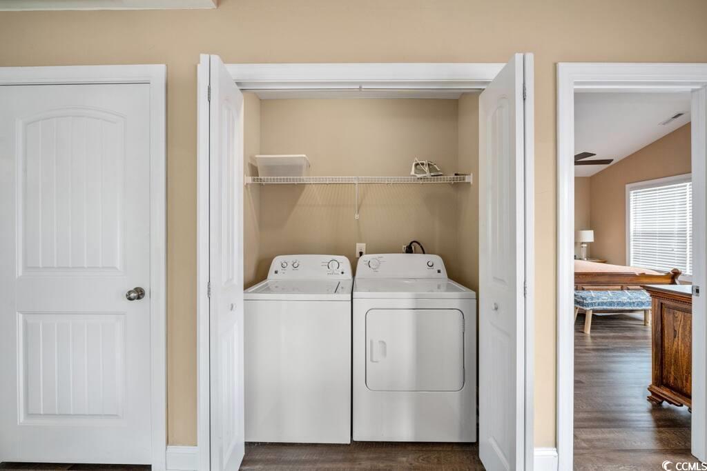 520 Caribbean Way Myrtle Beach, SC 29577 - Photo 8 of 21 Laundry area with dark wood-style flooring, washing machine and clothes dryer, and lofted ceiling