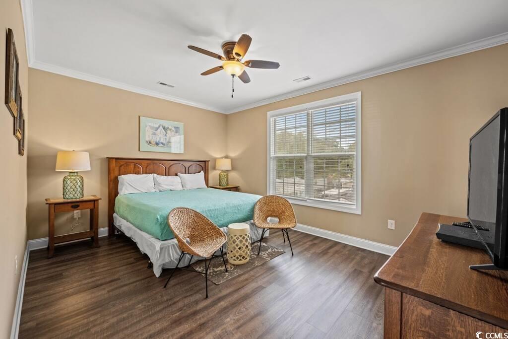 520 Caribbean Way Myrtle Beach, SC 29577 - Photo 10 of 21 Bedroom with ornamental molding, a ceiling fan, and dark wood-style flooring