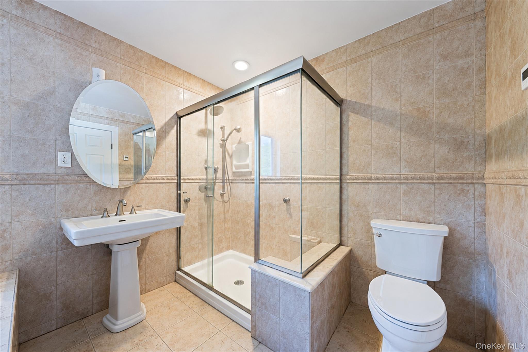 80 George Street Babylon, NY 11702 - Photo 32 of 41 a bathroom with a toilet a sink and mirror