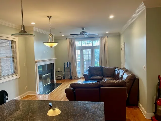 a living room with furniture fireplace and a window