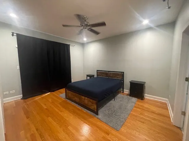 a bedroom with a bed and a walk in closet