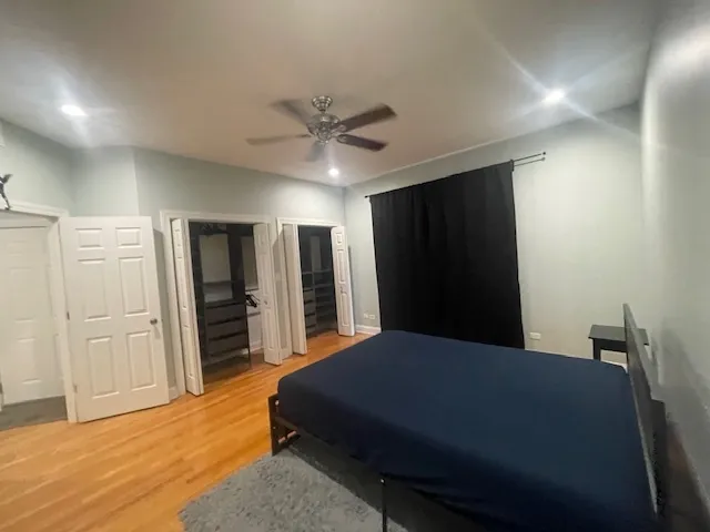 a bedroom with a bed and a television