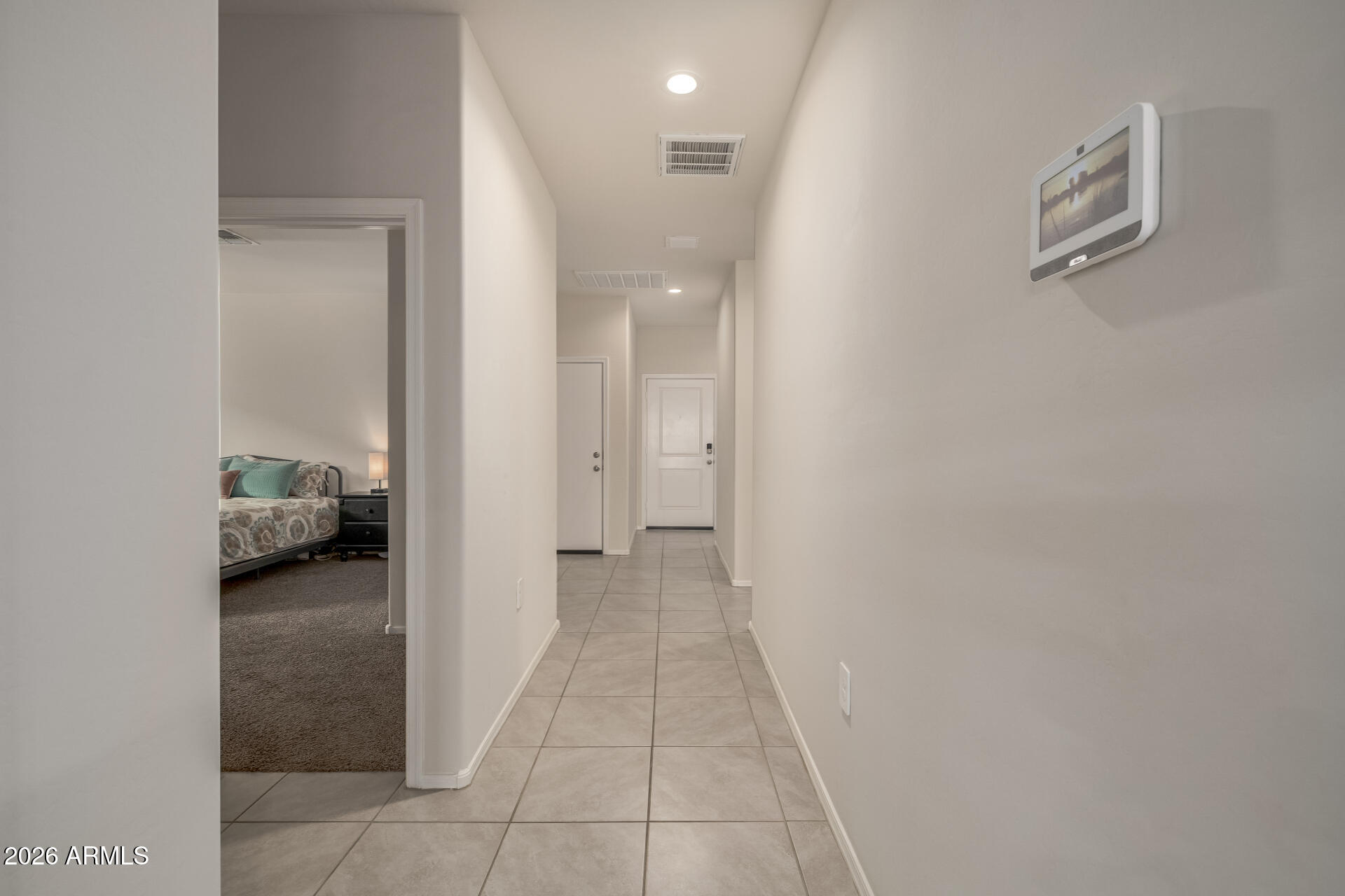 9471 Greenhouse Road Florence, AZ 85132 - Photo 19 of 22 a view of a hallway to a livingroom and a couch