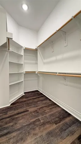 a view of a room with shelf on the wall