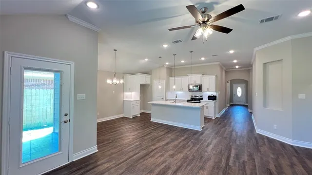 a view of kitchen with cabinets and wooden floor