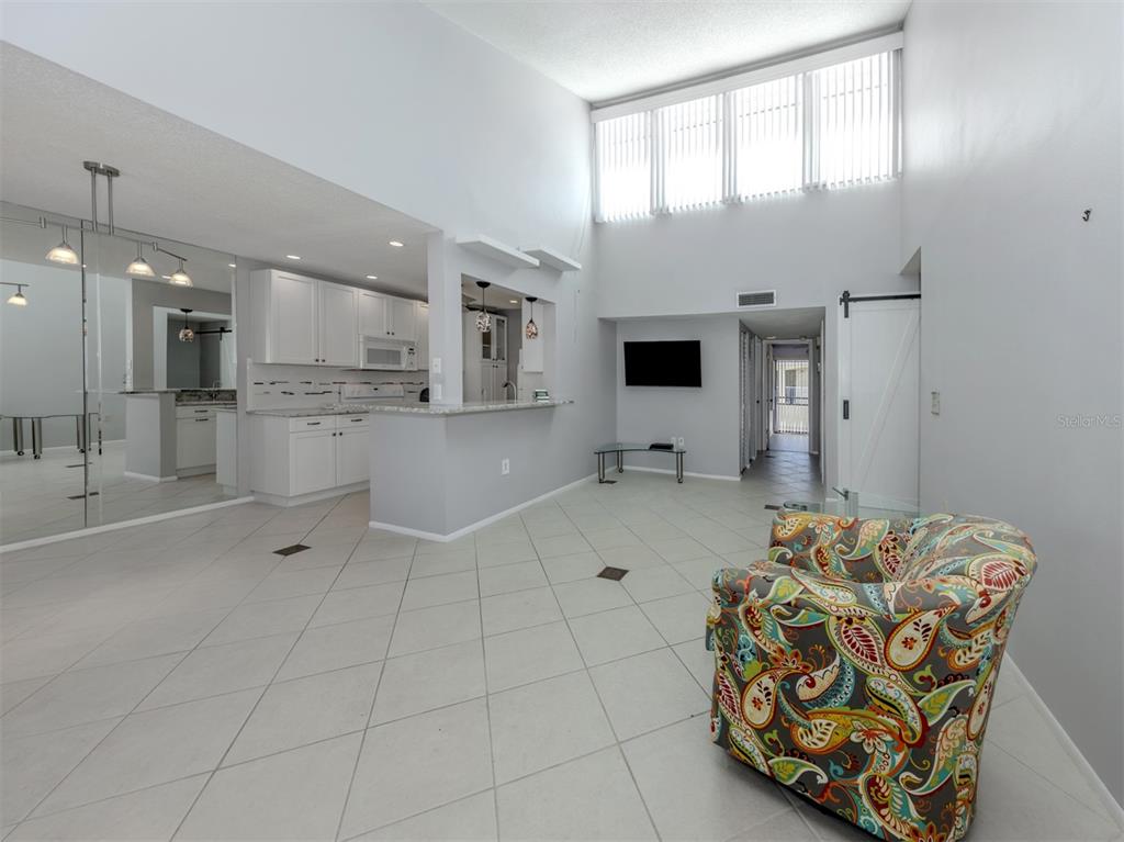 1555 Tarpon Center Drive, Unit 255 Venice, FL 34285 - Photo 7 of 57 a kitchen with stainless steel appliances a refrigerator and a sink