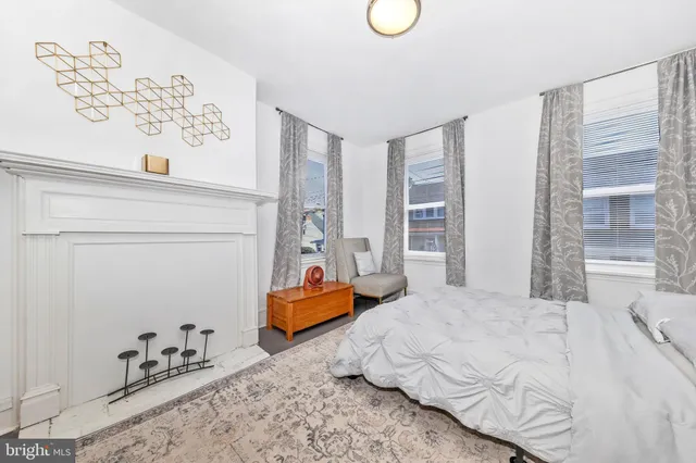 a bedroom with bed and window