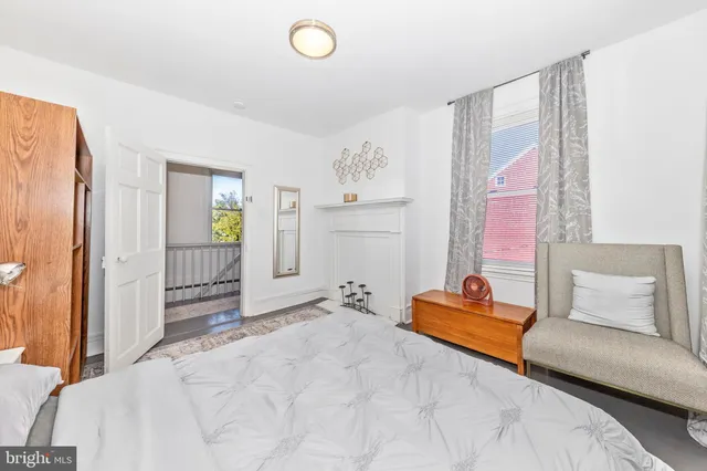 a bedroom with a bed and a couch