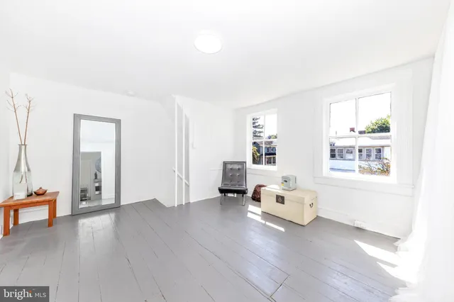 a bedroom with bed and a fireplace