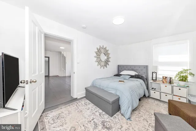 a bathroom with a sink toilet and mirror
