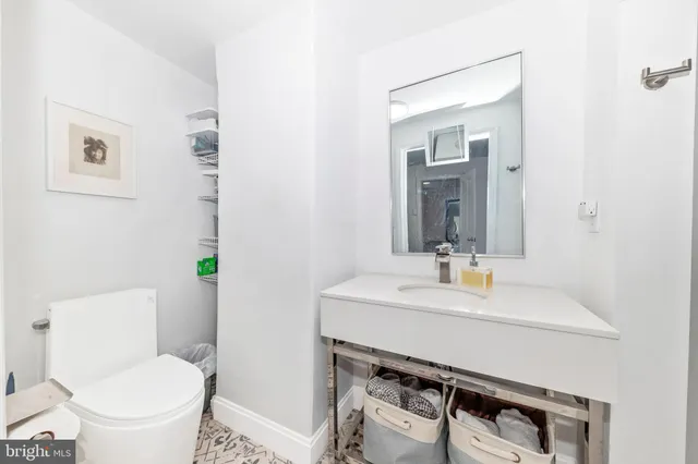 a view of a big house with a big yard and large tree