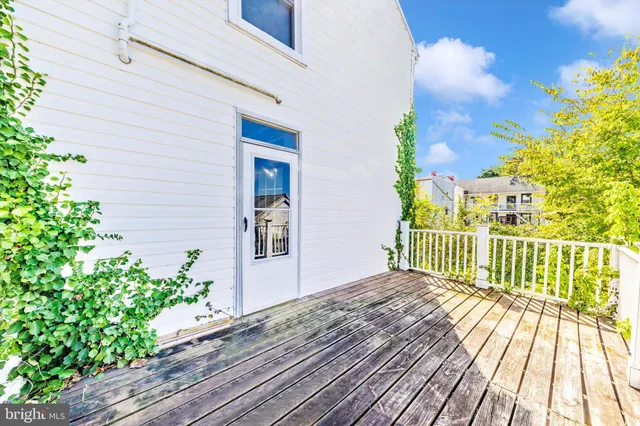 a view of a two chairs on the roof deck