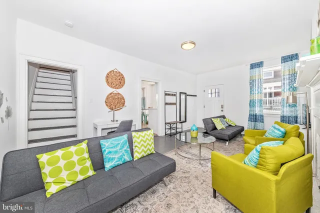 a living room with furniture and a window