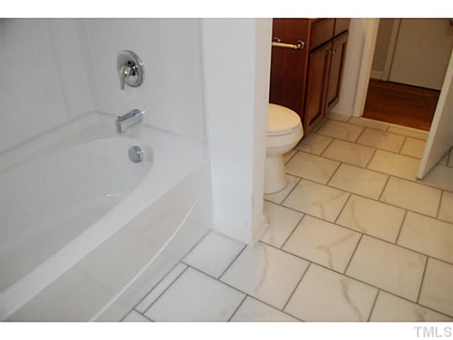 408 Latimer Road Raleigh, NC 27609 - Photo 11 of 24 First floor full bath has been completely renovated with gorgeous tile.