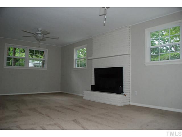 408 Latimer Road Raleigh, NC 27609 - Photo 13 of 24 This main level bonus room has great windows and a removable fireplace insert.