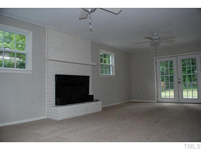408 Latimer Road Raleigh, NC 27609 - Photo 14 of 24 French doors open onto the patio.