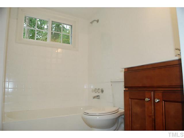 408 Latimer Road Raleigh, NC 27609 - Photo 15 of 24 Full bath located on the main level adjacent to the master bedroom and bonus room.